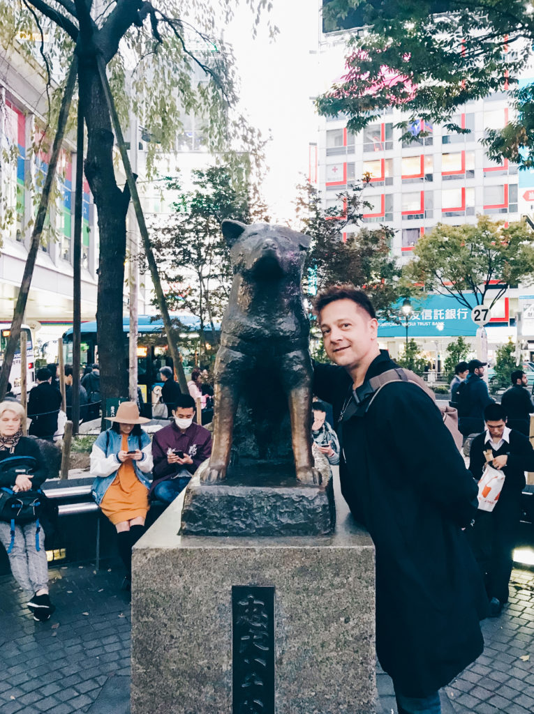 Stephen poses next to a statue of the dog Hachiko in Shibuya, Tokyo