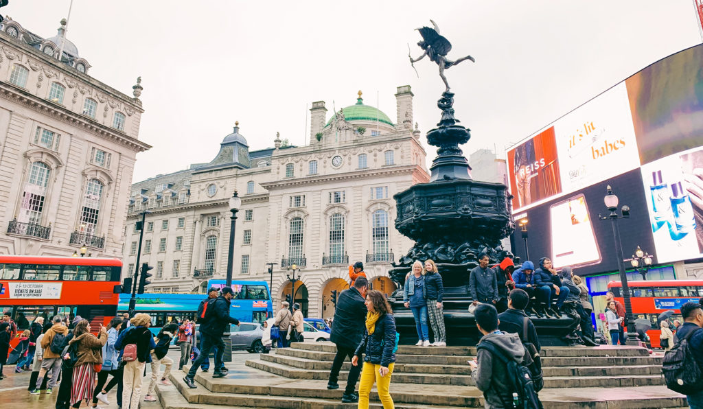 People and a double decker bus in Piccadilly Circus, London