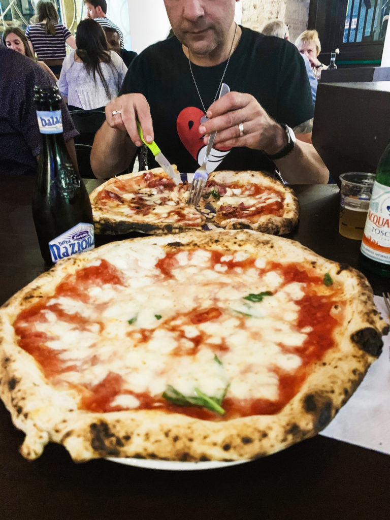 pizzas at Sorbillo, one of the top pizzerias in Naples, Italy