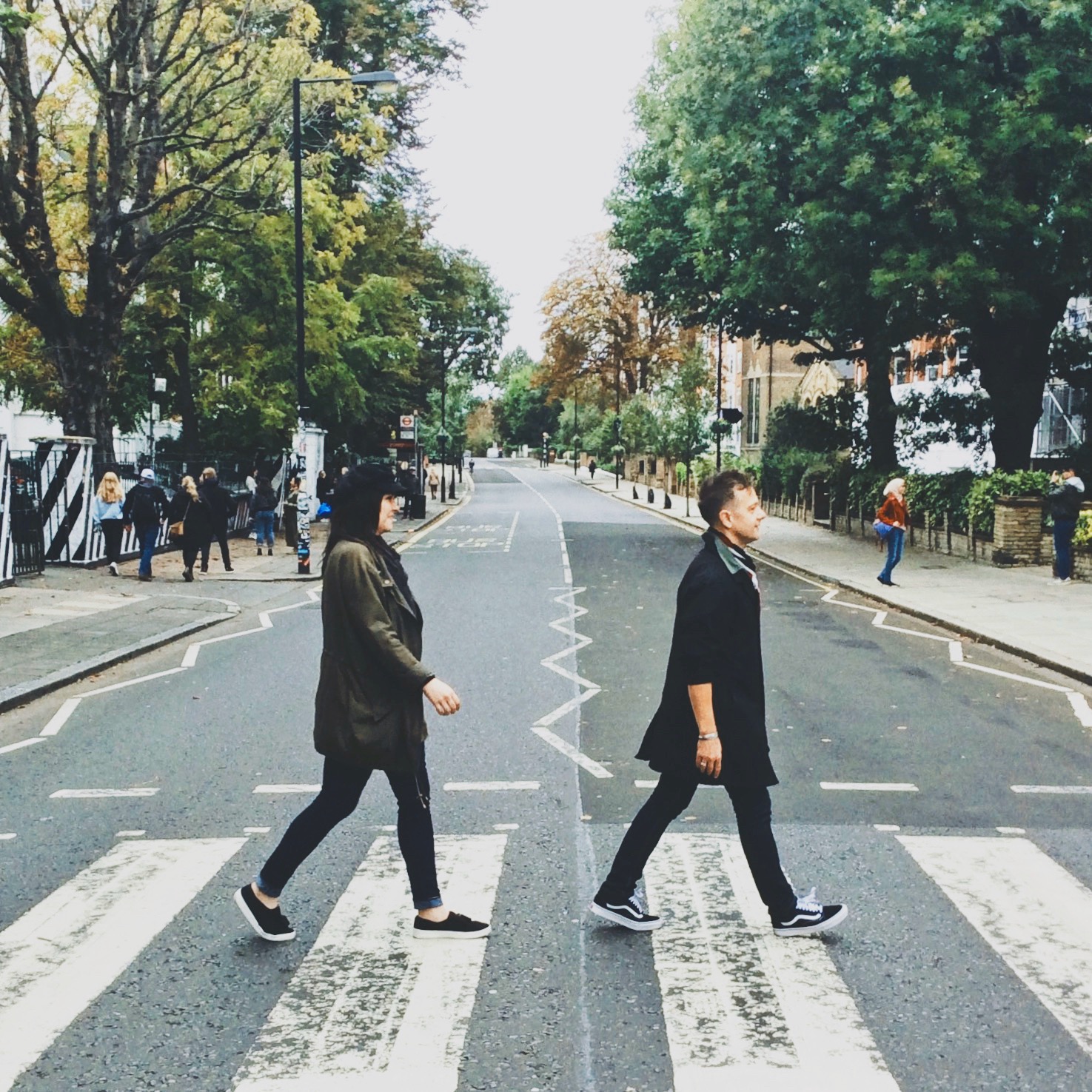 Stephen & Andie cross the street at the famous Abbey Road crossing in London, England