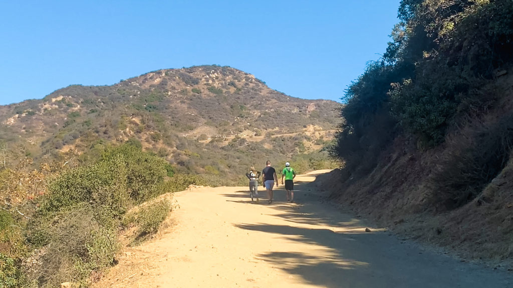 hikers on the trail leading up to the Hollywood Sign