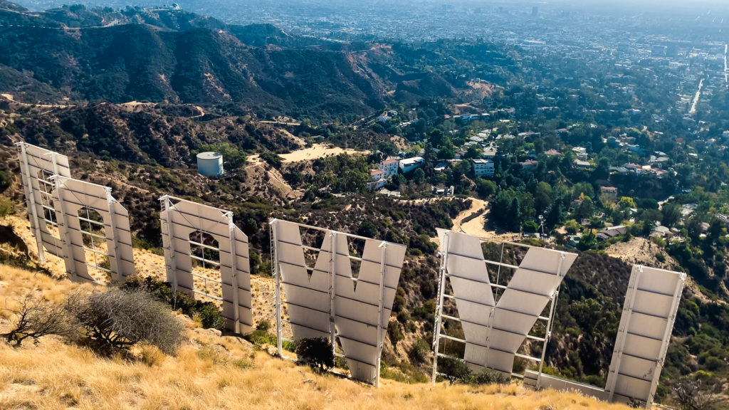 a view of Los Angeles from behind and above the Hollywood Sign