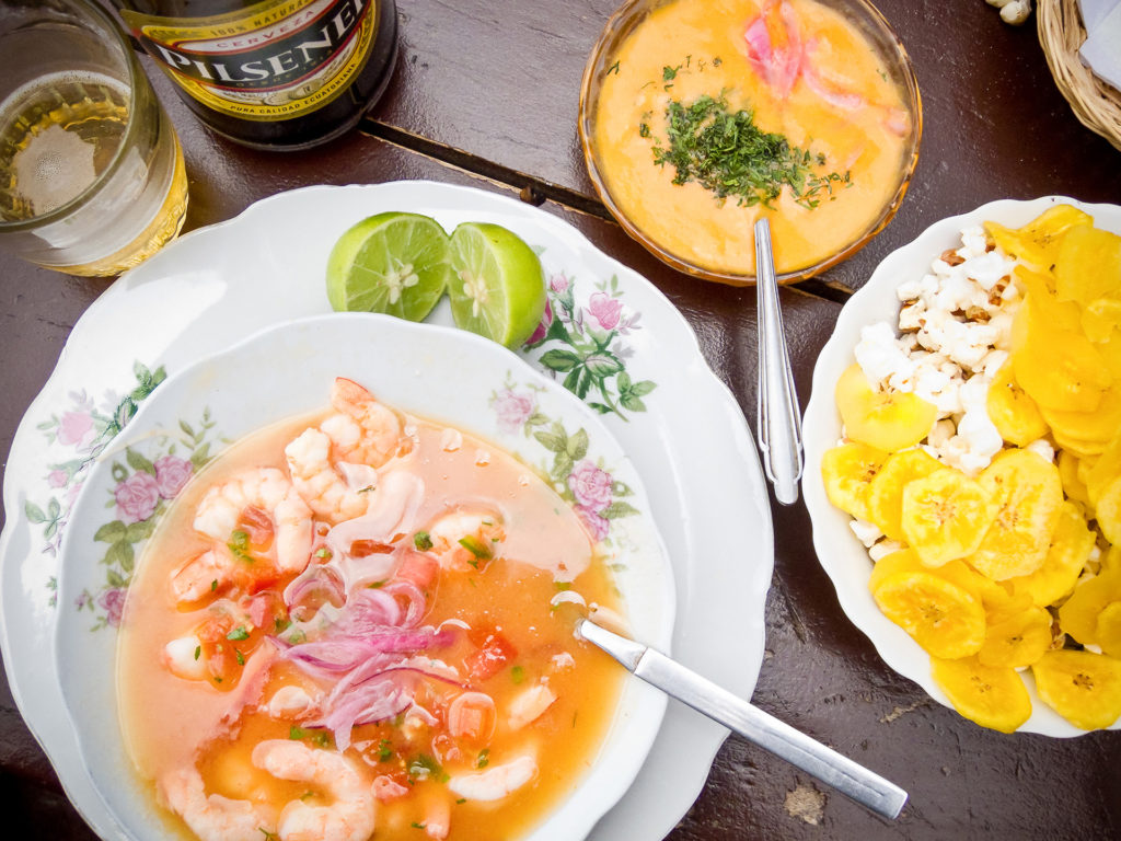 shrimp ceviche with popcorn, plantains, and a beer in Quito, Ecuador