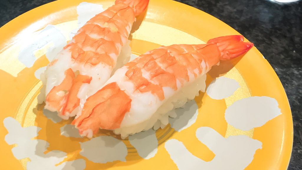 two shrimp sushi on a yellow plate