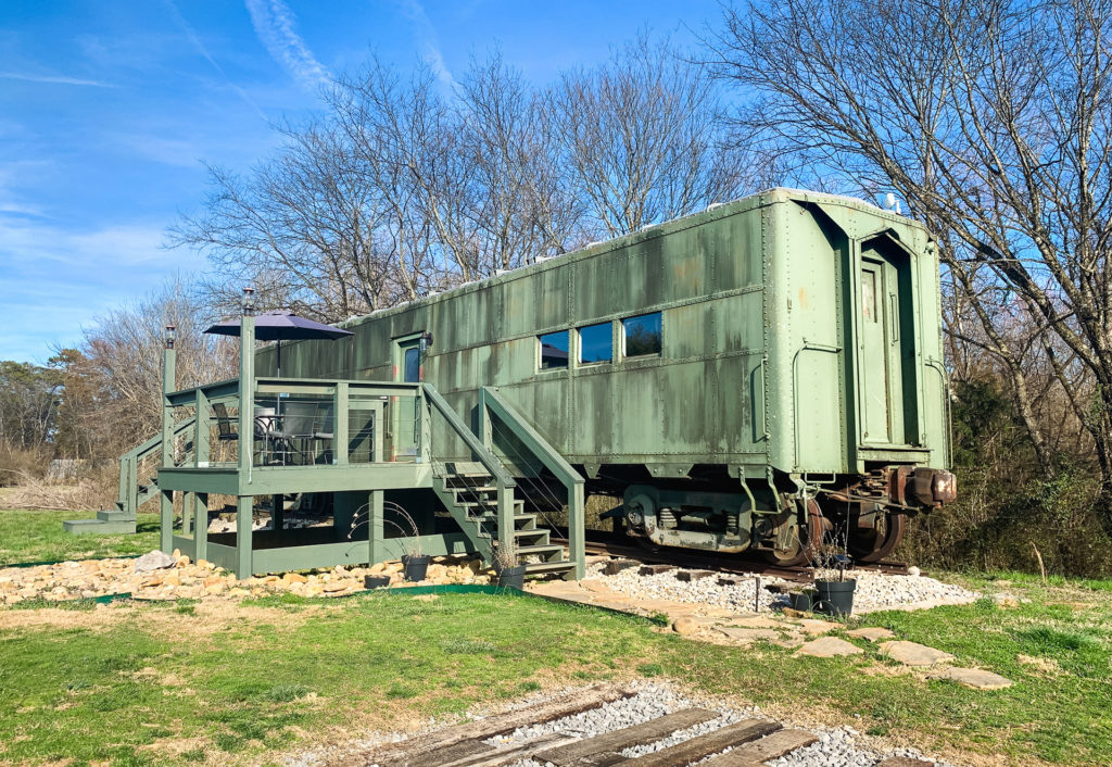 the exterior of the WWII Train Car Airbnb we rented in Maryville, Tennessee