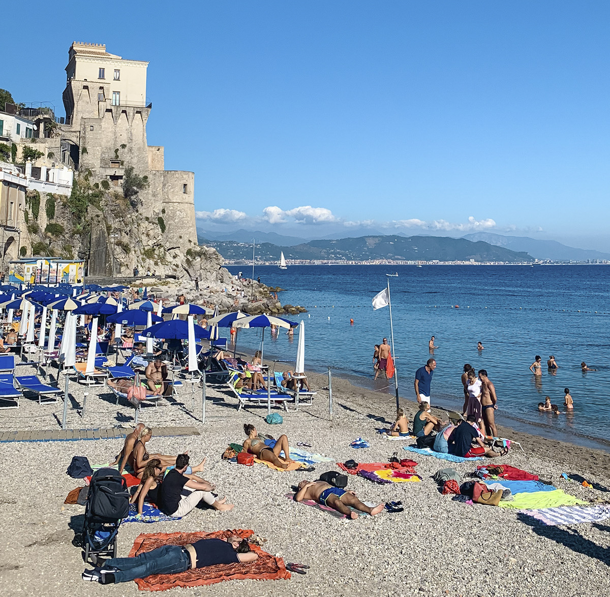 a beach on the Amalfi Coast of Italy in October; shoulder season is the best time to travel there