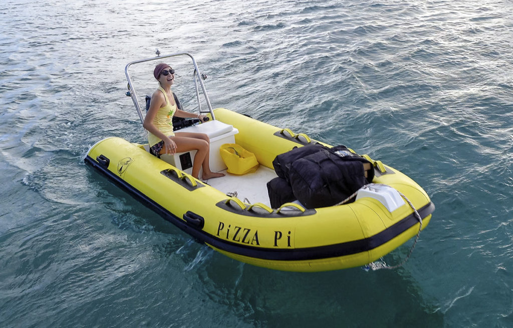 pizza delivery by Pizza Pi on the water, by dinghy, in the U.S. Virgin Islands.