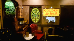 Vintage signage and decor in the waiting area of The Golden Steer Steakhouse in Las Vegas.